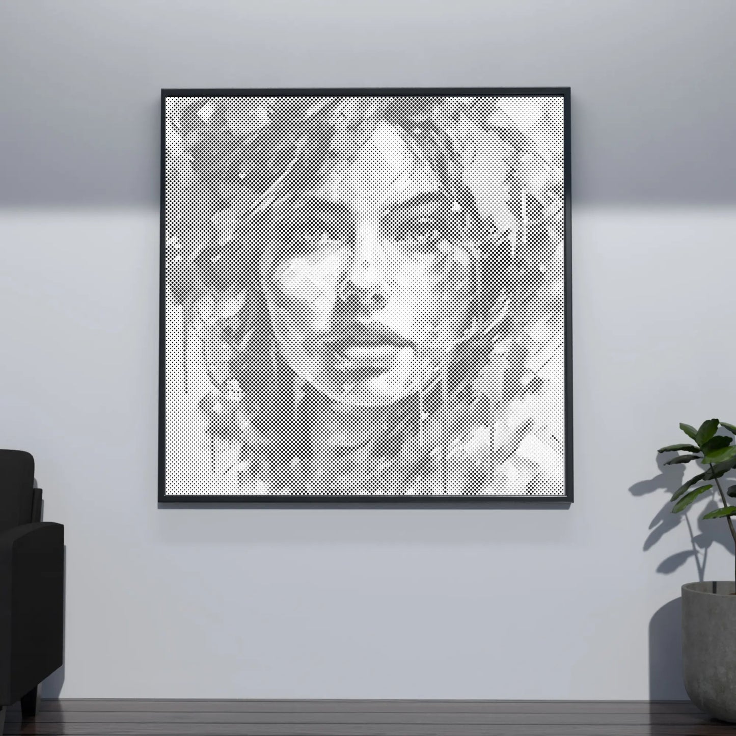 Framed black and white portrait art on a wall in a room with a plant and sofa. Modern Woman Portrait | Dot Painting Kit