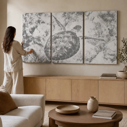 Woman arranging abstract wall art in a living room. Sea Turtle Ocean | Multi Panel Dot Painting
