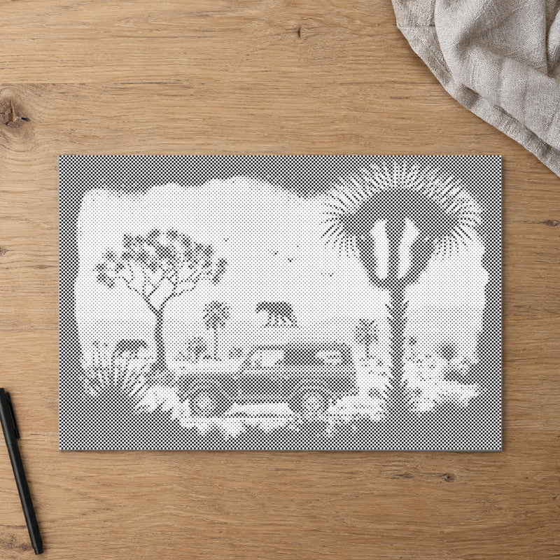 Stippenschilderij “Avontuur in de wildernis”, van bovenaf op een werktafel bij zacht daglicht.