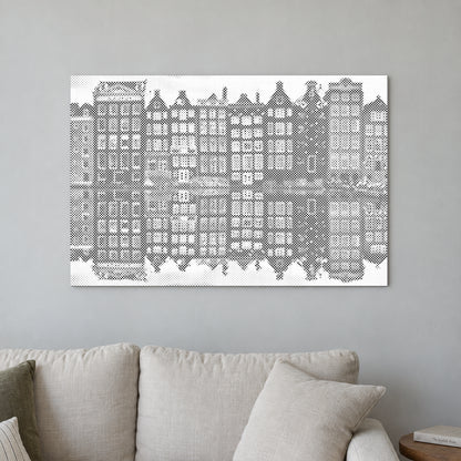 Stippenschilderij “Amsterdamse Huizen”, aan een lichte muur in een kamer met zacht daglicht.