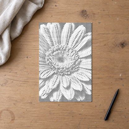 Stippenschilderij “Gerbera Bloem”, van bovenaf op een werktafel bij zacht daglicht.