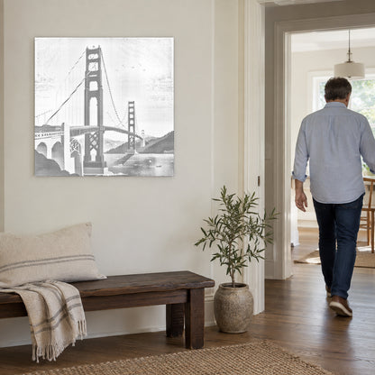 Stippenschilderij “Golden Gate Bridge”, aan een lichte muur, met iemand die door de deur ernaast loopt.