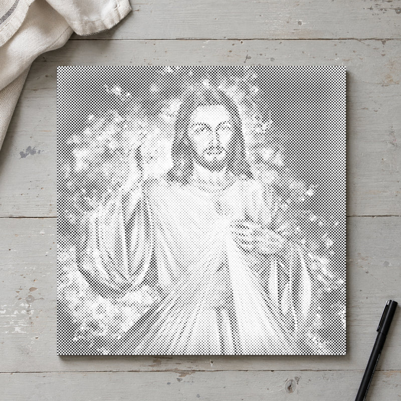 Stippenschilderij “Jezus: Het Vervolg”, van bovenaf op een werktafel bij zacht daglicht.