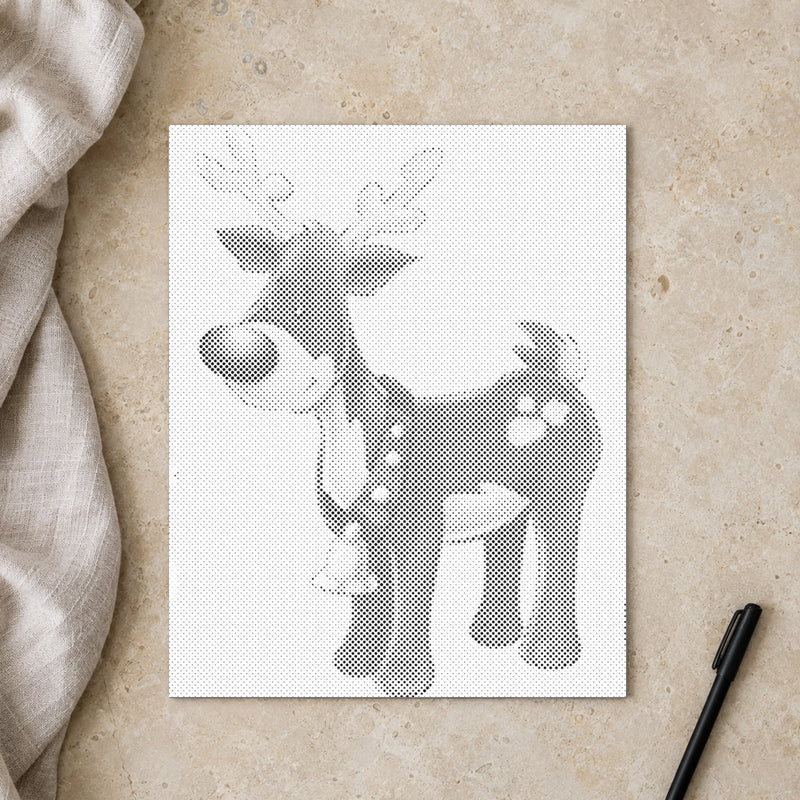 Stippenschilderij “Rudolph het Rendier met de Rode Neus”, van bovenaf op een werktafel bij zacht daglicht.