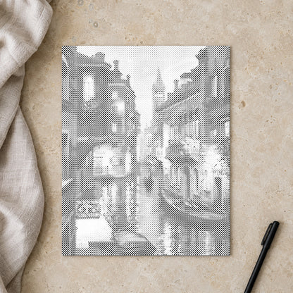 Stippenschilderij “Venetië bij Nacht”, van bovenaf op een werktafel bij zacht daglicht.